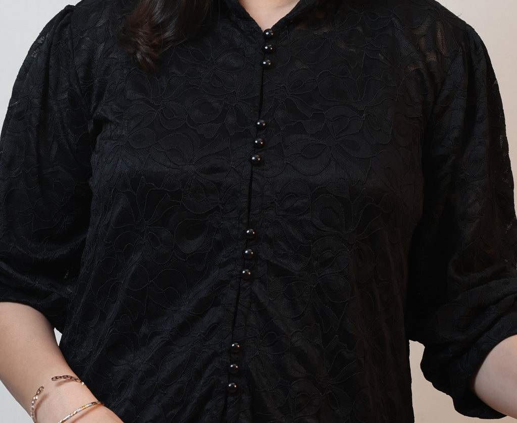 Upper body close-up puff sleeve and pearl buttons on women's black schiffli lace workwear shirt Ladymade