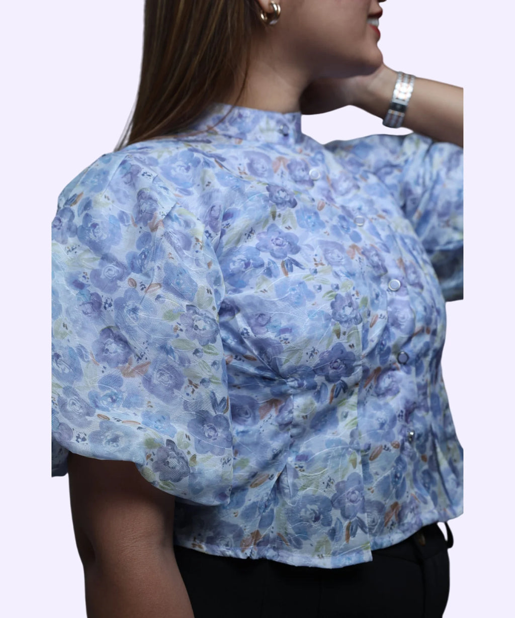Close-up puff sleeve volume and chiffon fabric detail women's blue floral print high neck workwear top Ladymade