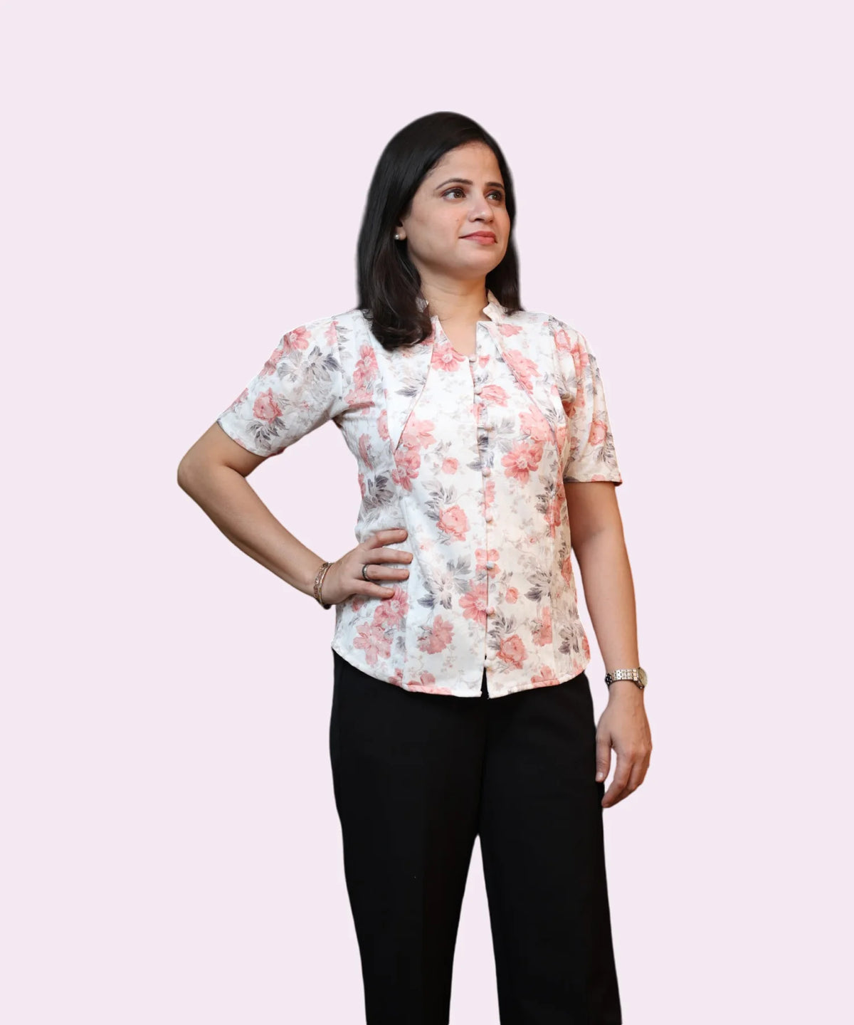 Close-up of floral print on ivory top
