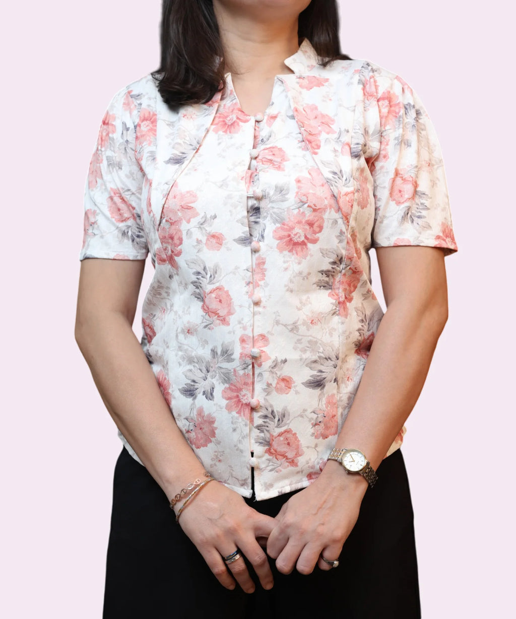Button detail on ivory floral workwear top