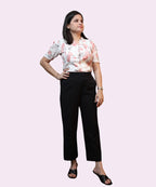 Model wearing ivory floral office wear top