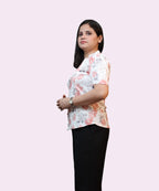 Side profile of floral white workwear top