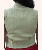 Close-up of back fabric texture on mint green eyelet cap sleeve shirt for women