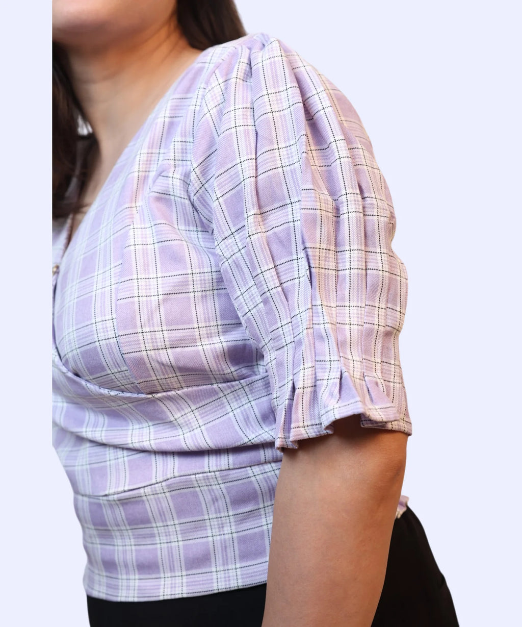 Close-up of puff sleeve frill cuff detail on lavender checks wrap workwear top Ladymade