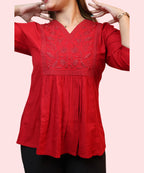 Close-up of tone-on-tone floral embroidery yoke on red workwear kurti Ladymade