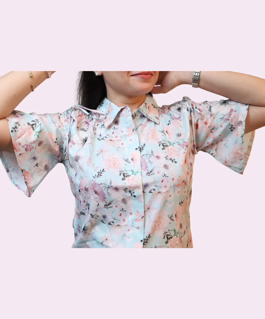 Close-up women's sky blue floral collared shirt flutter sleeves fully spread drawstring shoulder detail Ladymade