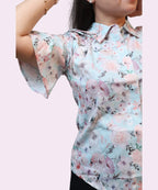 Side angle women's sky blue floral print workwear shirt flutter sleeve drawstring shoulder tie close-up Ladymade