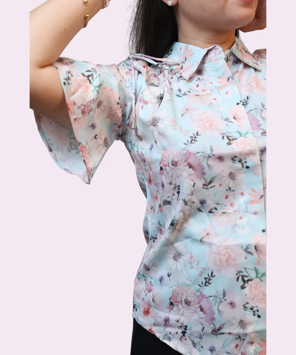 Side angle women's sky blue floral print workwear shirt flutter sleeve drawstring shoulder tie close-up Ladymade
