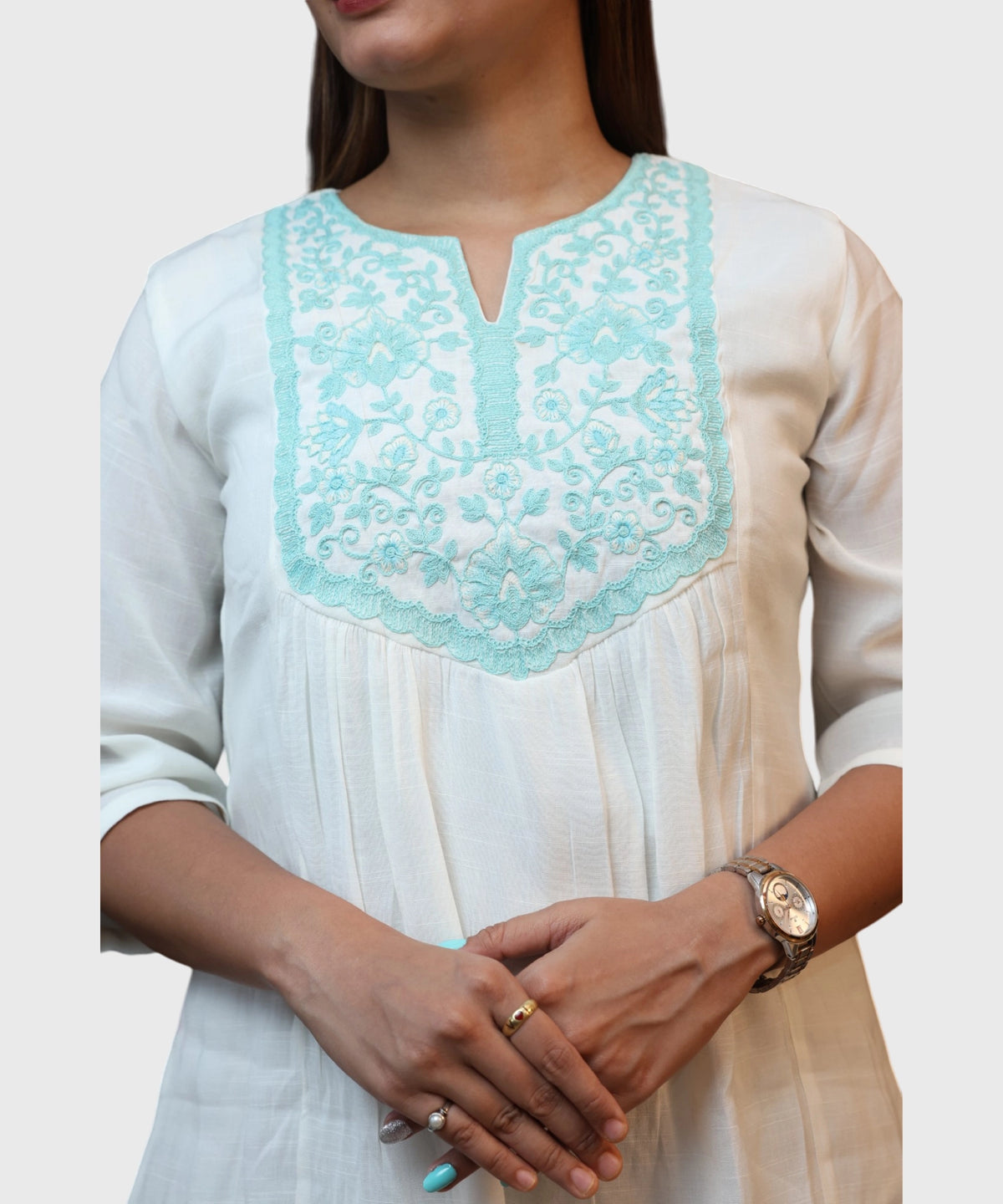 Close-up turquoise floral embroidered yoke and notch neckline detail white cotton kurti top Ladymade