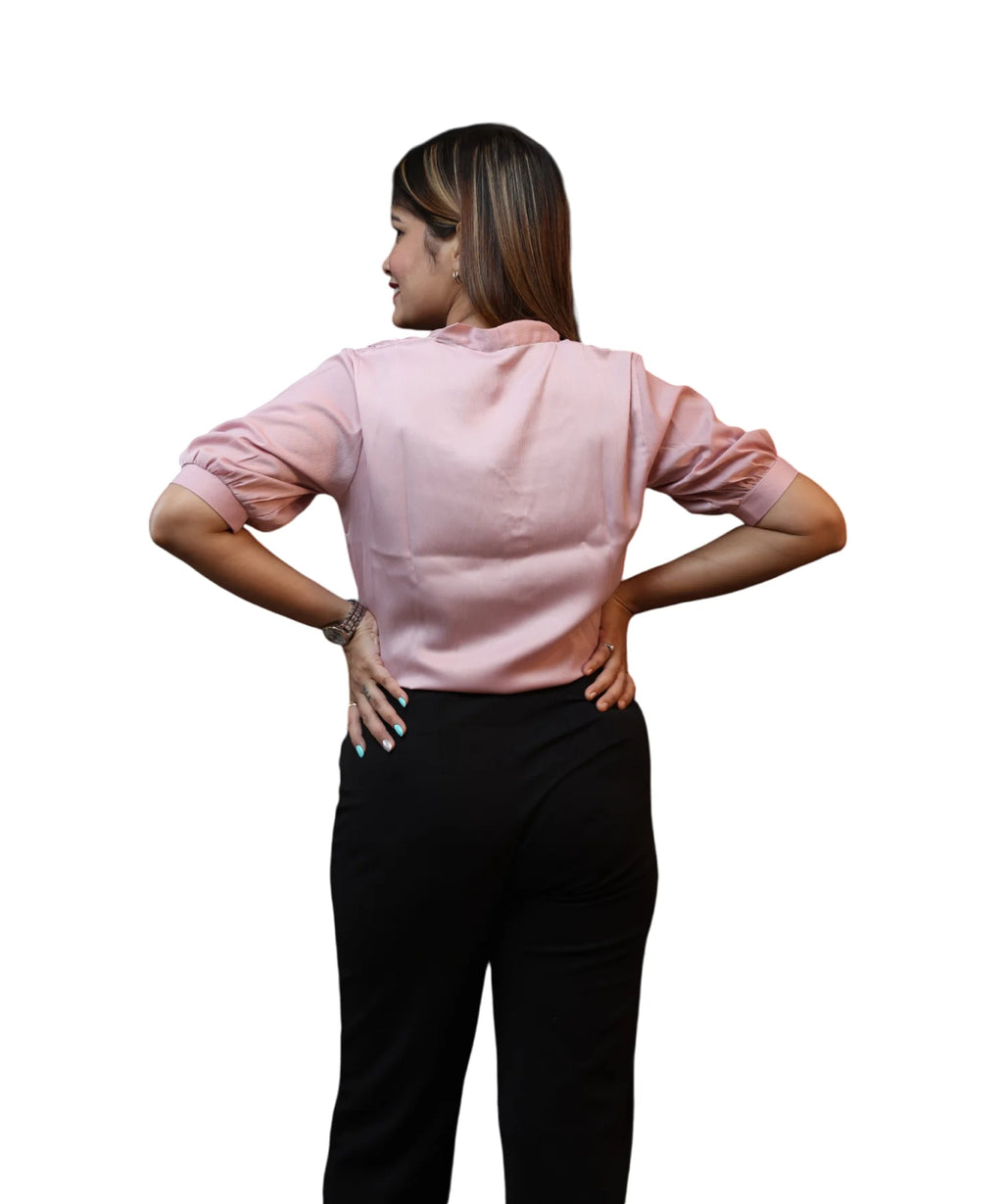 Back view women's baby pink satin puff sleeve formal blouse hands on hips gathered cuff workwear Ladymade