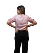 Back view women's baby pink satin puff sleeve formal blouse hands on hips gathered cuff workwear Ladymade