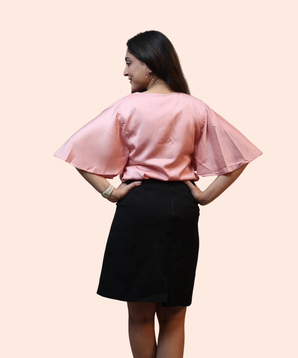 Back view women's baby pink satin cape sleeve workwear blouse full length black pencil skirt Ladymade