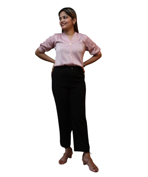 Full length women's baby pink satin puff sleeve blouse V-neck gold brooch tucked black trousers nude heels Ladymade