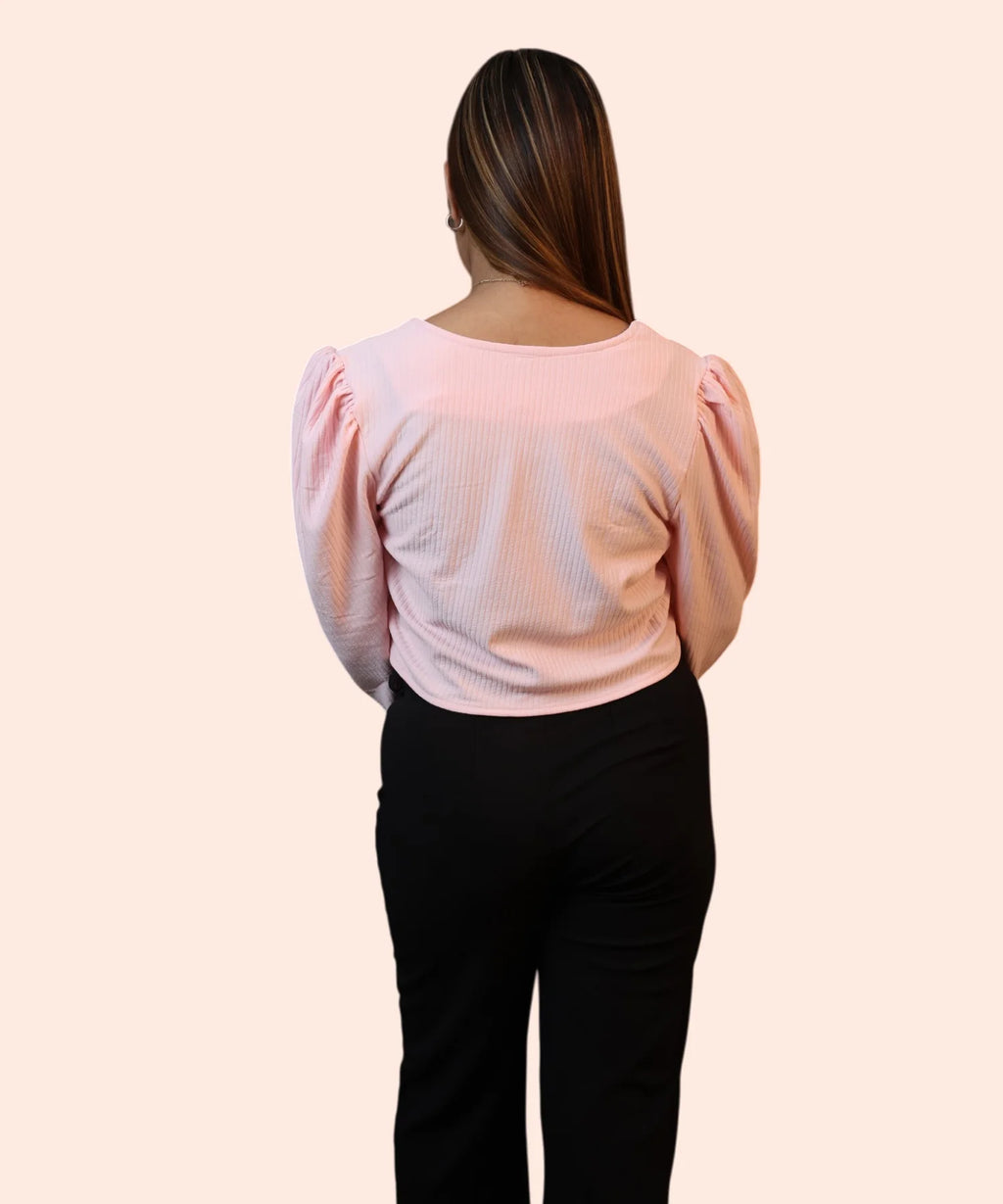 Close-up back view illustrating the clean shoulder gathers and ribbed texture on a women's baby pink corporate top by Ladymade.