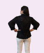 Back view women's black schiffli lace shirt scalloped hem full sleeve workwear cream trousers Ladymade