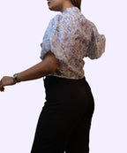 Side back angle women's blue floral chiffon high neck peplum top puff sleeve workwear black trousers Ladymade