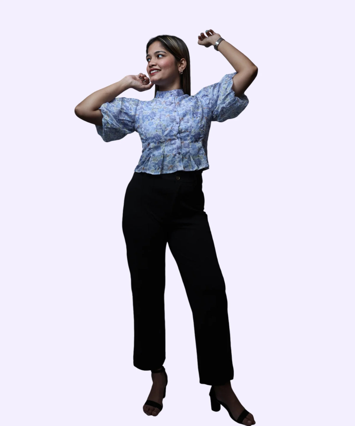 Full length women's blue floral chiffon peplum top dynamic pose puff sleeves black trousers block heels Ladymade