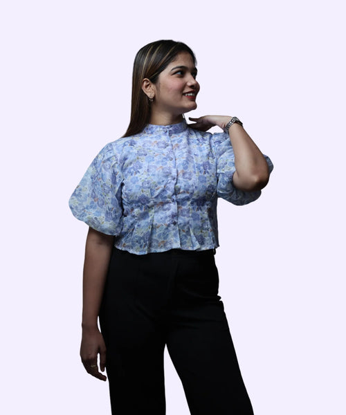 Three-quarter angle women's blue floral print high neck peplum top puff sleeve pleated front workwear Ladymade