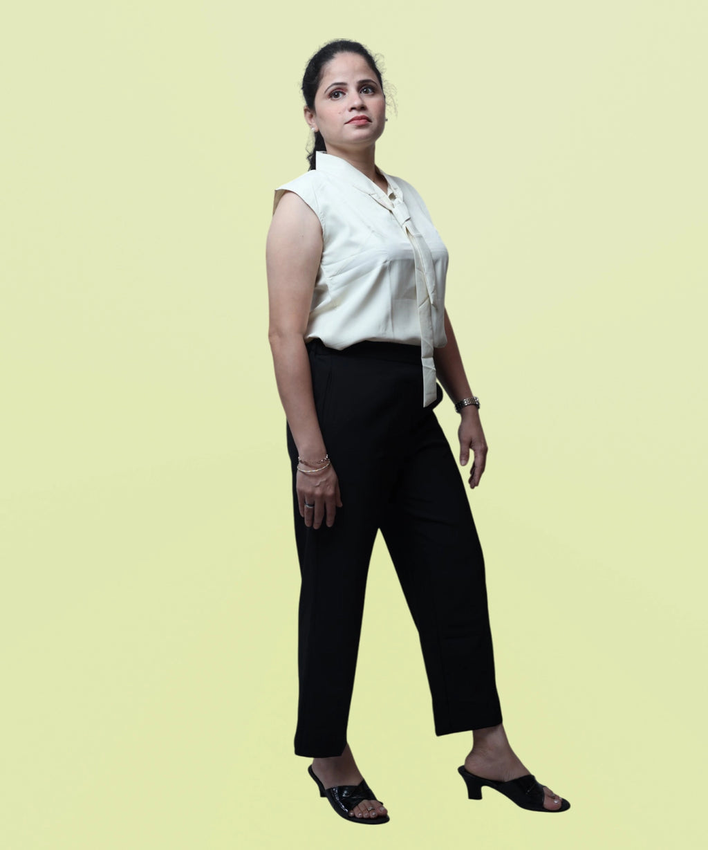 Side profile view illustrating the comfortable armhole cut and drape of a polycotton workwear top by Ladymade.