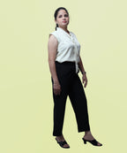 Side profile view illustrating the comfortable armhole cut and drape of a polycotton workwear top by Ladymade.