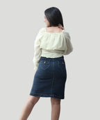 Back view close-up showing the stretch smocked rear panel and square neckline tailoring of a yellow chiffon blouse by Ladymade.