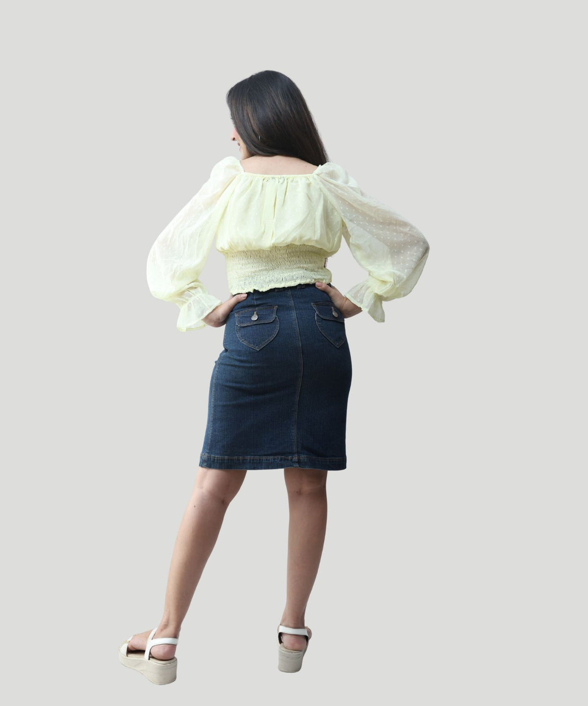 Full back profile showing the regular fit and gathered waistline details of an office and evening wear top by Ladymade.