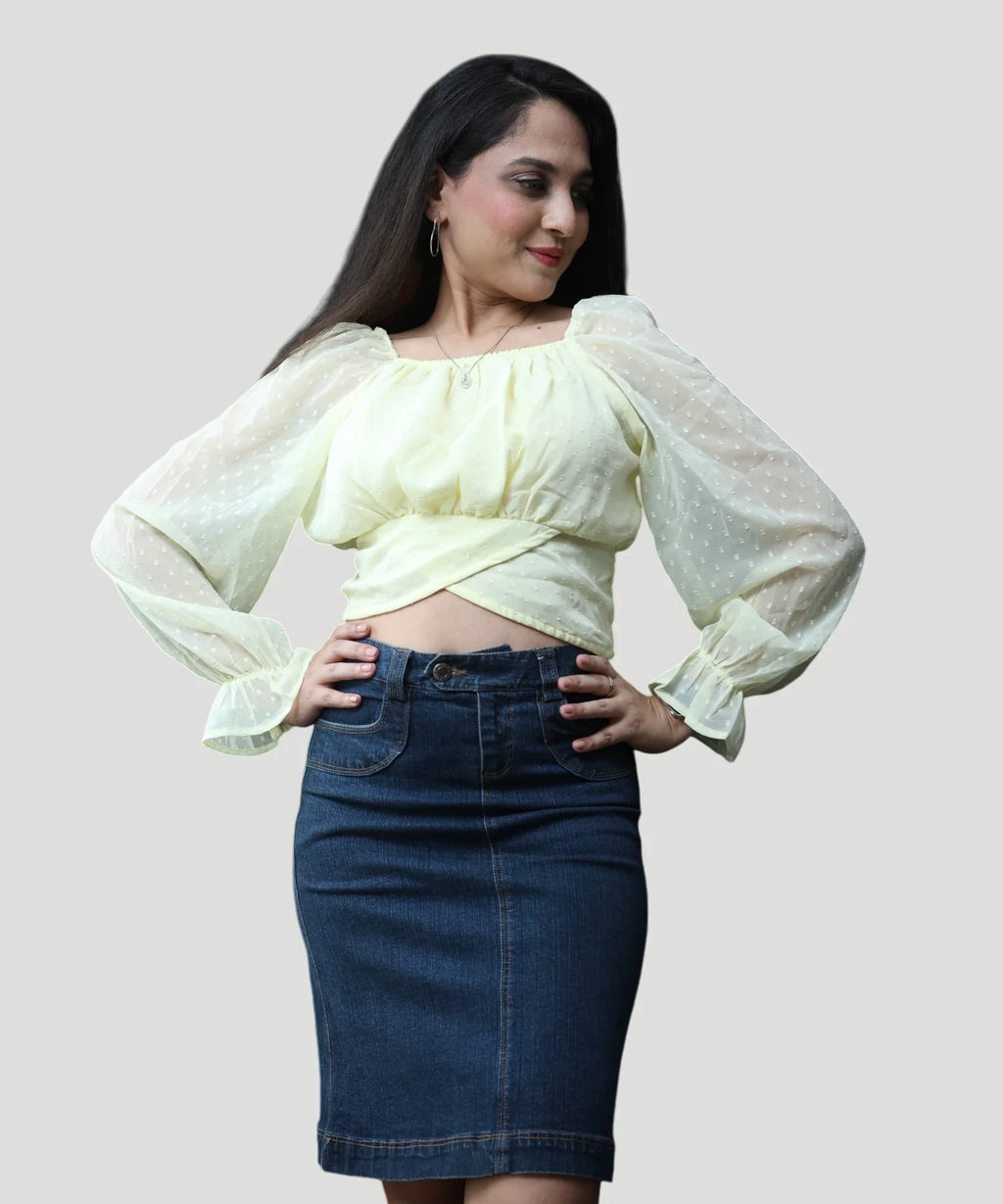 Close-up front view portrait of a woman modeling a premium lemon yellow chiffon crop top with a square neckline by Ladymade.