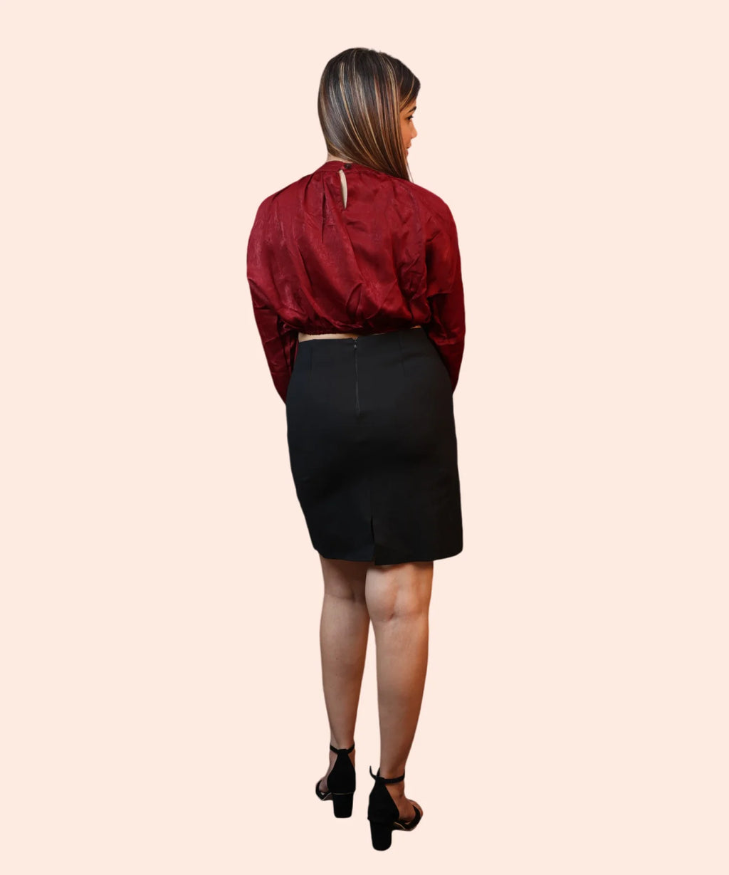 Back profile shot showing the keyhole closure and clean shoulder tailoring of a maroon velvet office top by Ladymade.