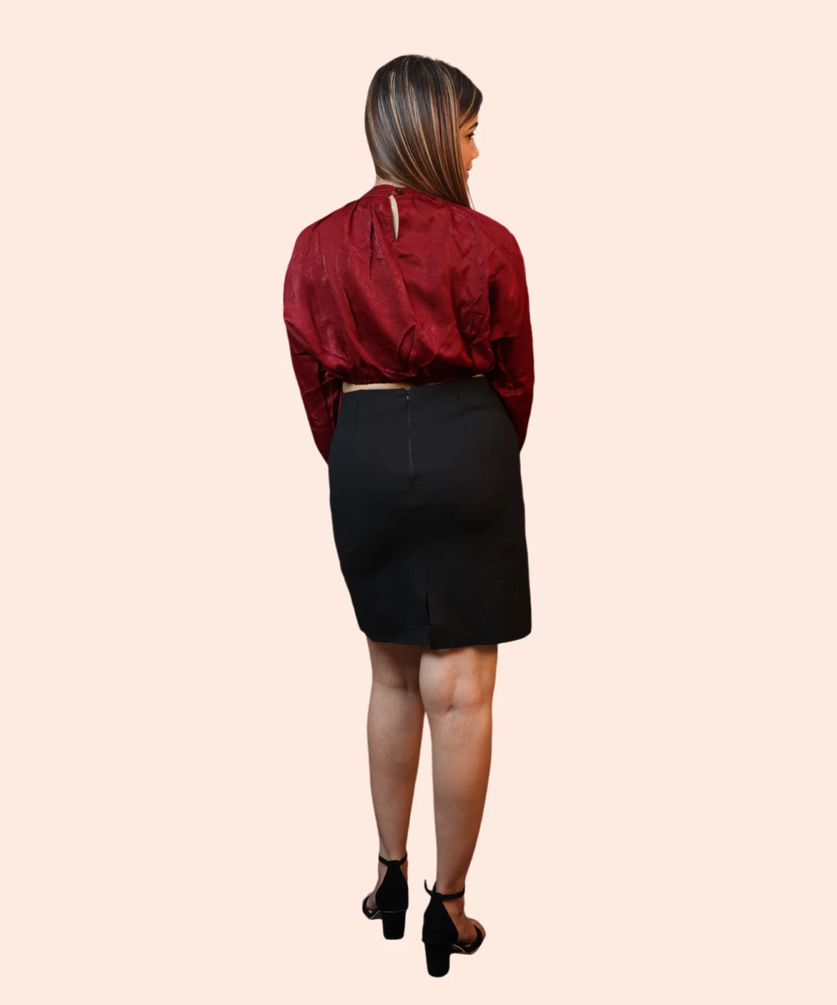 Back profile shot showing the keyhole closure and clean shoulder tailoring of a maroon velvet office top by Ladymade.