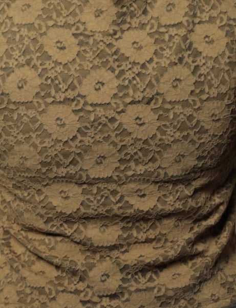 Close-up of floral lace fabric pattern on mehndi green puff sleeve workwear top Ladymade