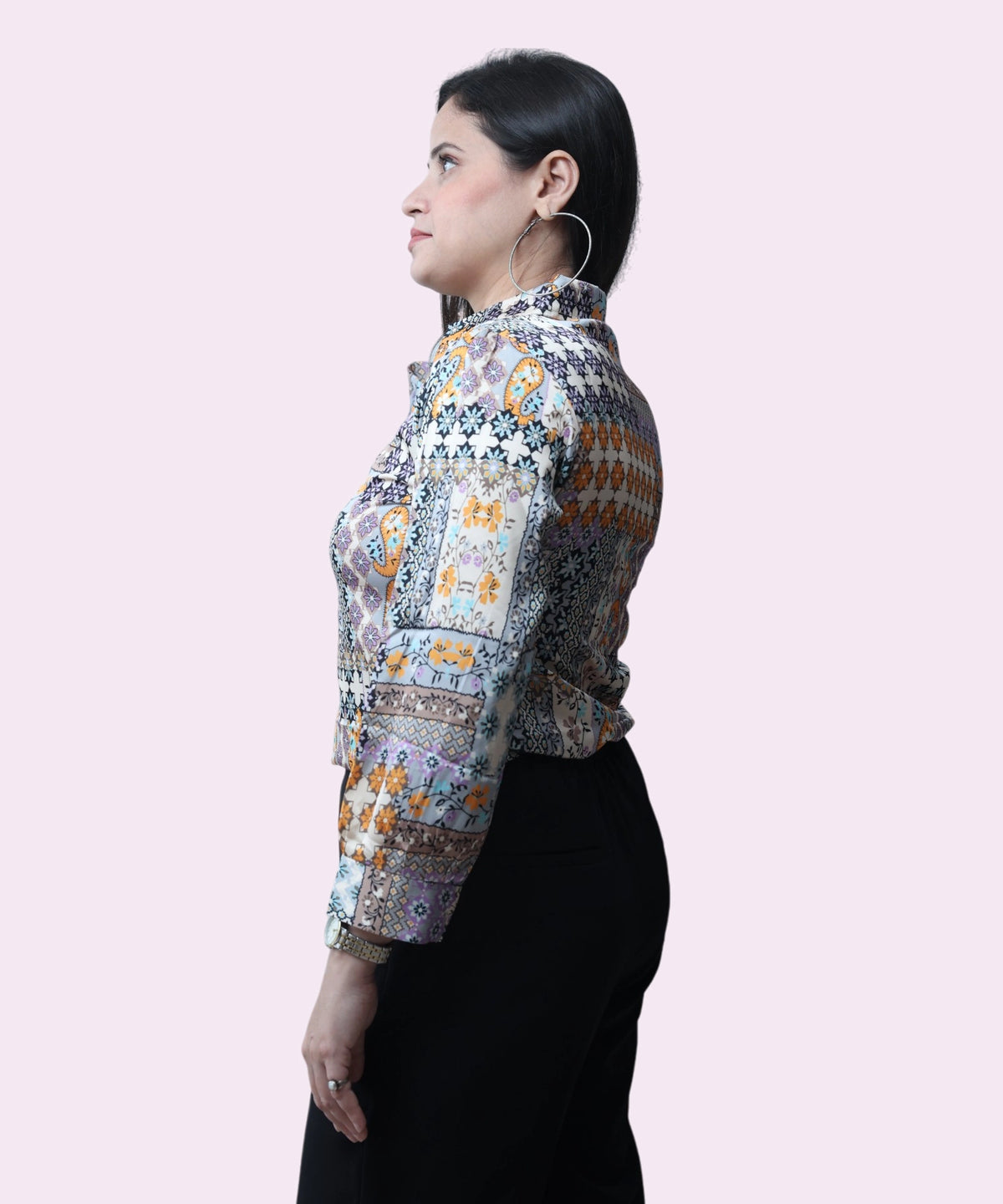 Profile view of a woman wearing a premium satin tribal print blouse with a structured collar by Ladymade.