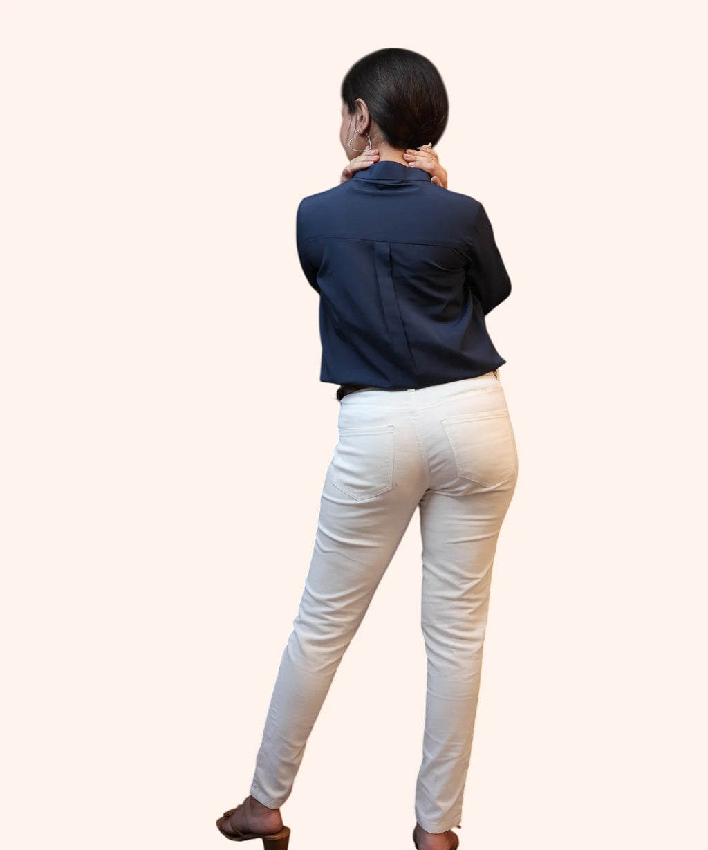 Full back view showing the structured shoulder tailoring and fabric finish of a women's navy blue formal shirt by Ladymade.