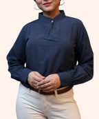 Mid-shot view highlighting the clean pleated front and cuffed long sleeves of a navy blue polycotton office blouse by Ladymade.