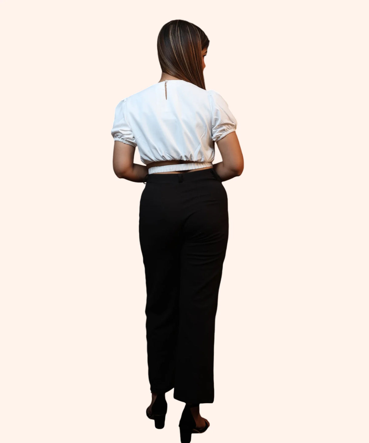 Full-length back view showcasing the clean regular fit and smocked waist configuration of an off-white workwear blouse by Ladymade.