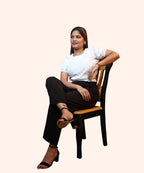 Studio portrait of a woman looking away while wearing an off-white round neck puff sleeve crop top by Ladymade.