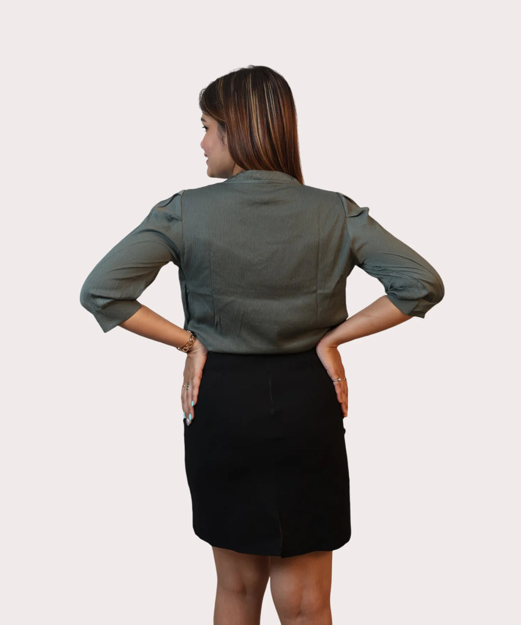 Full back view showcasing the clean shoulder tailoring and structured regular fit of an office wear top by Ladymade.