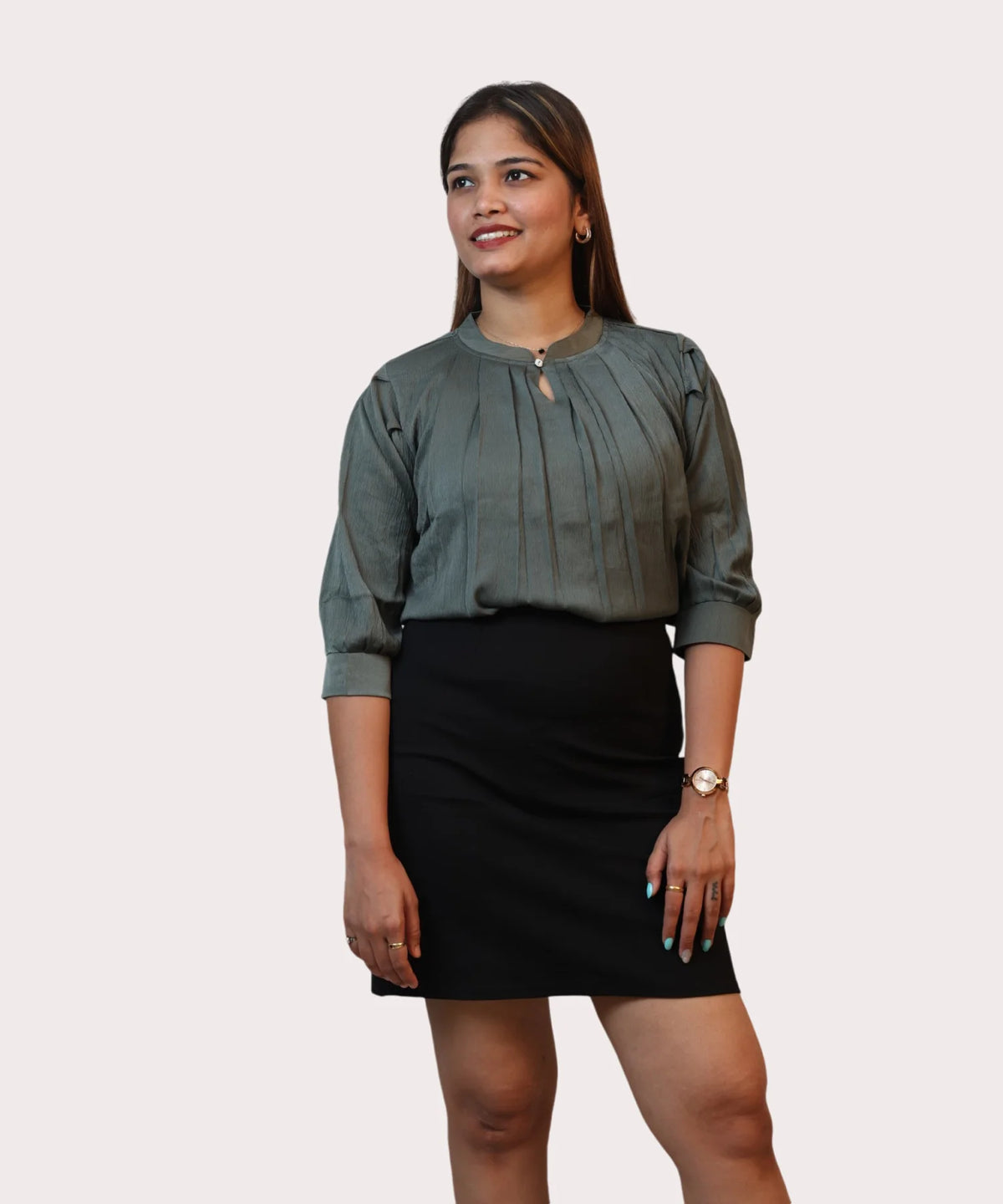 Symmetrical medium shot of a woman modeling an olive green keyhole neck office blouse with a black skirt by Ladymade.