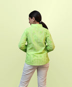 Back view of women's parrot green schiffli floral embroidered full sleeve shirt Ladymade