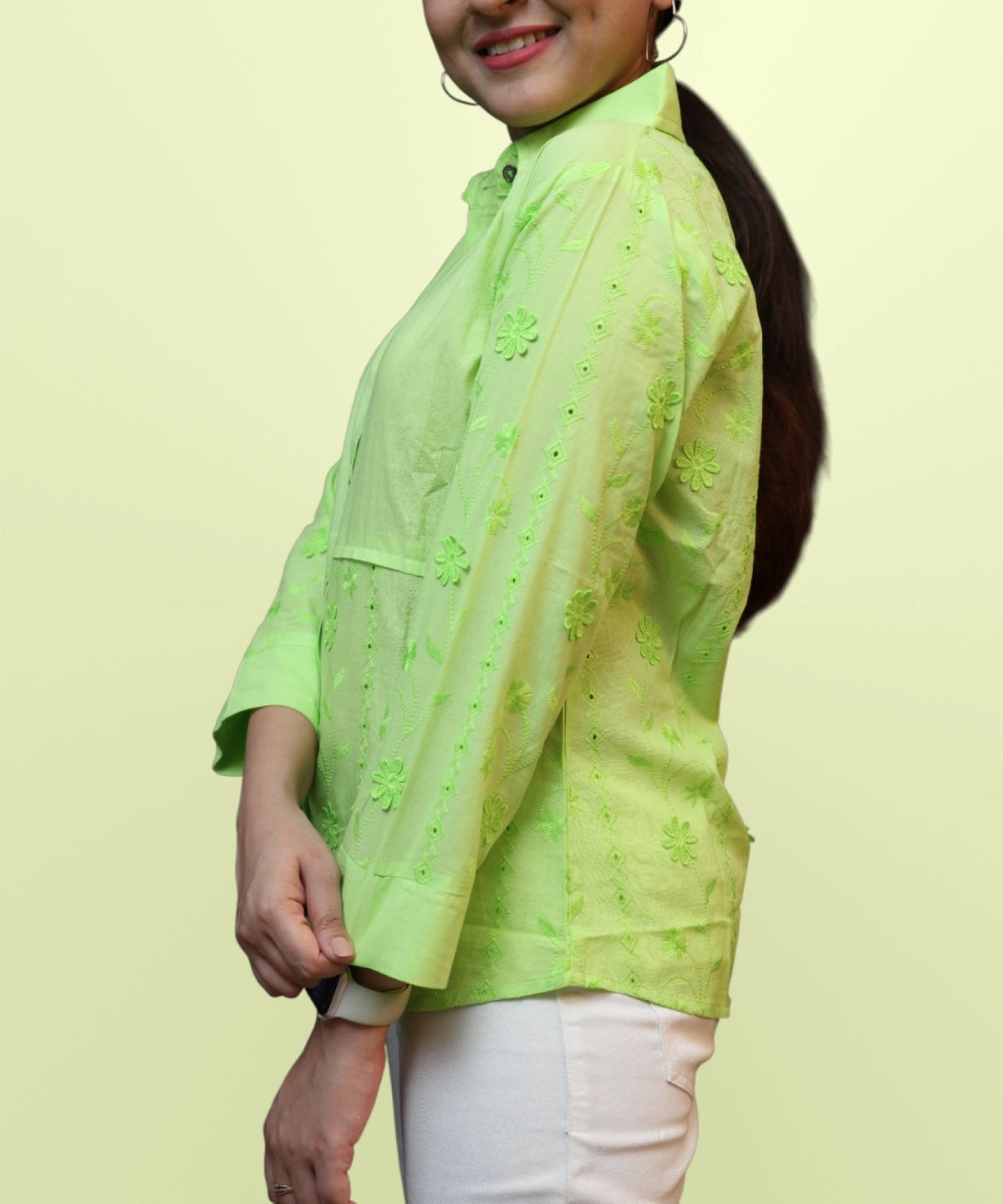 Left side view of women's parrot green schiffli embroidered workwear shirt silhouette Ladymade