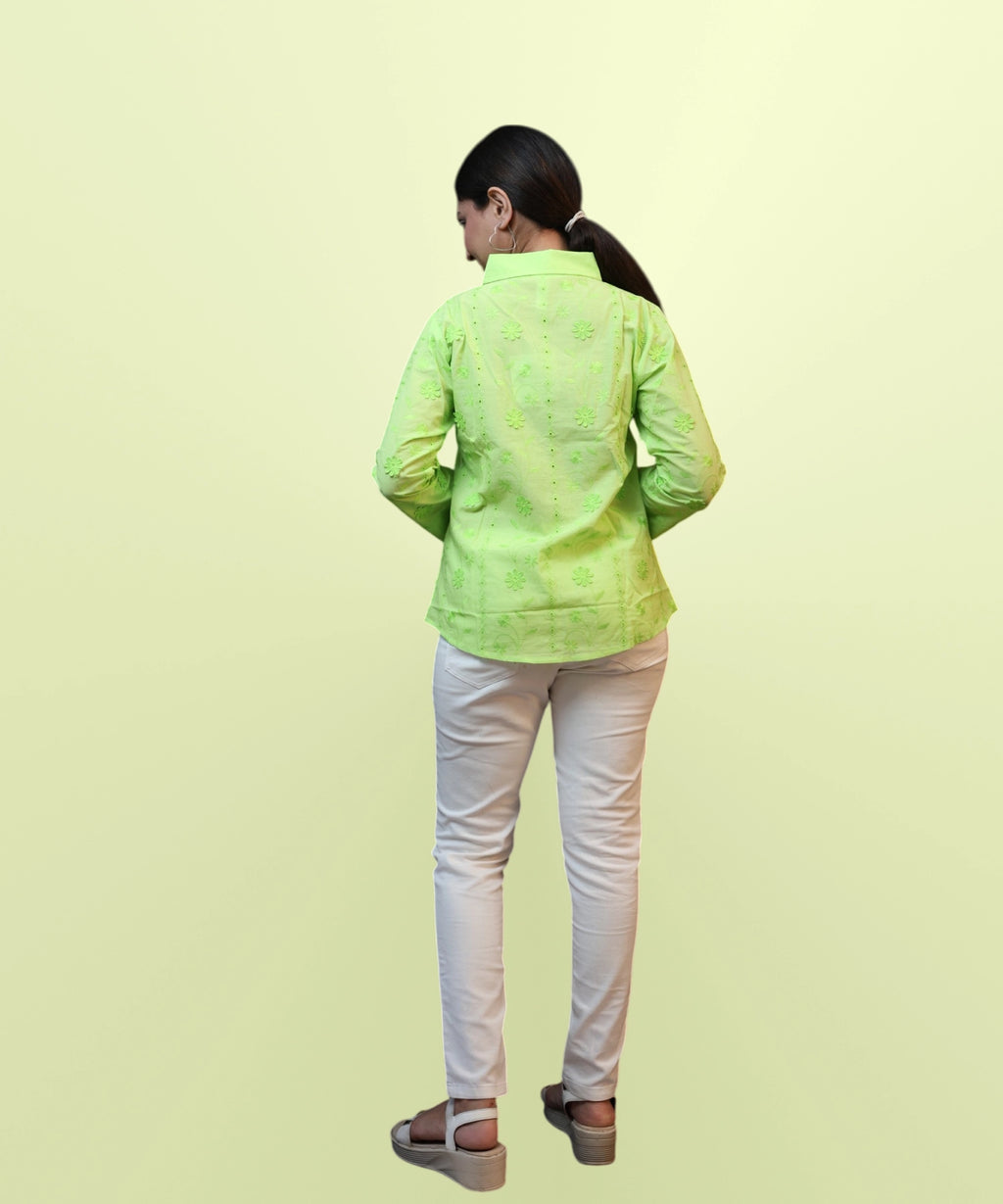 Full length back view of women's parrot green schiffli embroidered shirt white trousers Ladymade