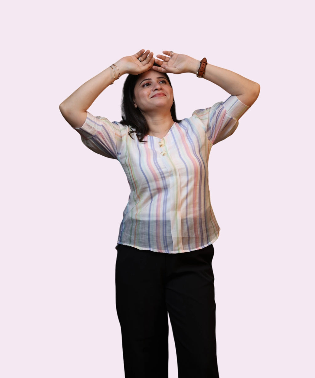 Women's pastel viscose stripe puff sleeve top arms raised dynamic pose black trousers Ladymade