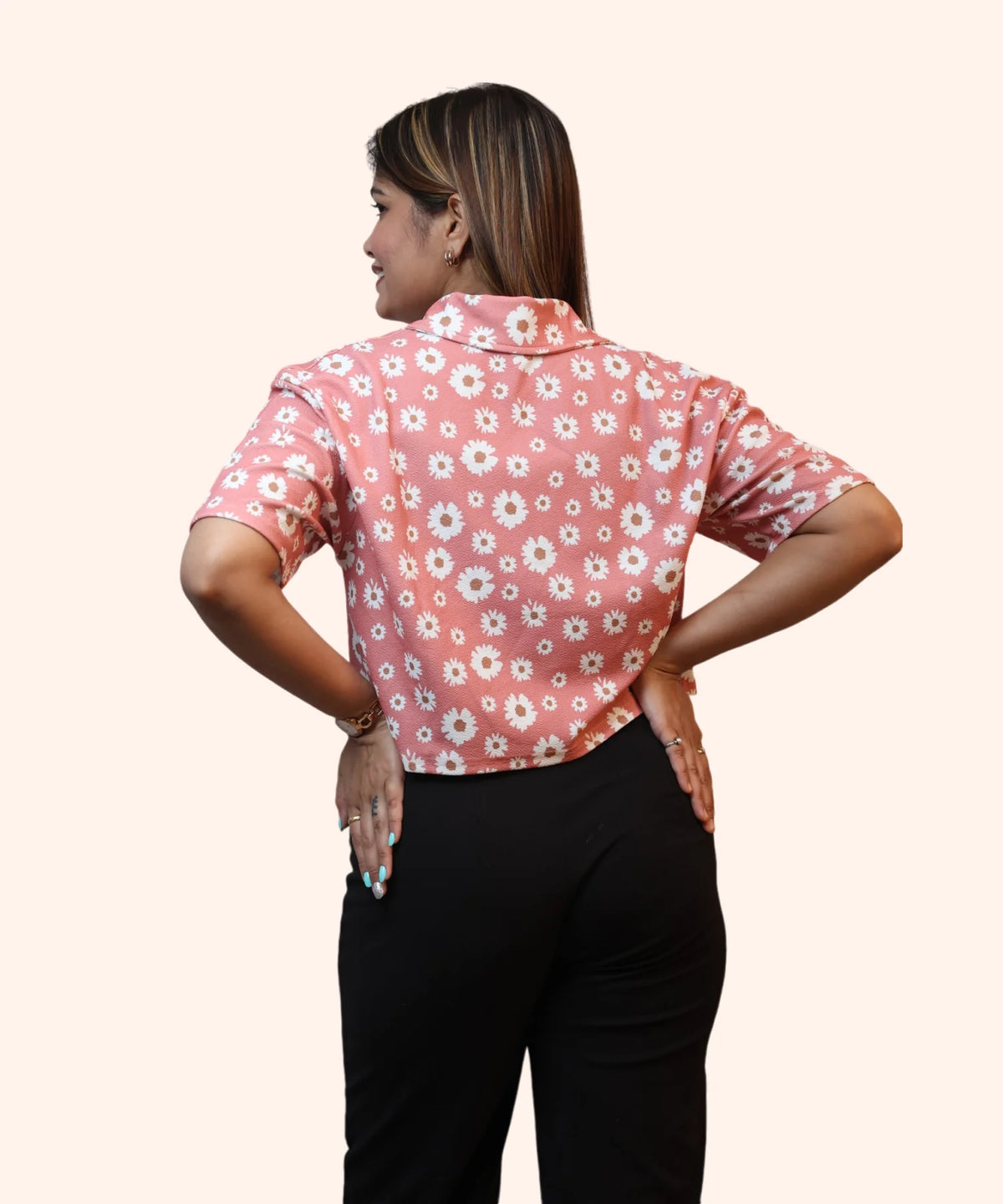 Back view close-up showing the shoulder paneling and regular fit of a peach pink workwear top by Ladymade.