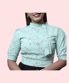 Close-up mock neck and asymmetric overlap front detail pista green floral puff sleeve workwear top Ladymade