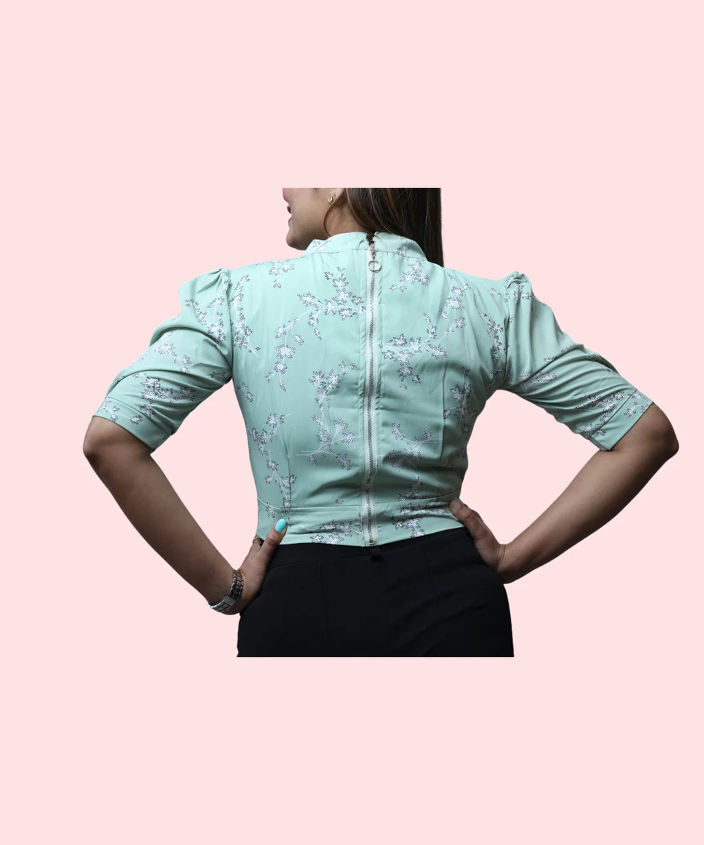 Back view women's pista green floral mock neck top with back zip closure puff sleeves Ladymade