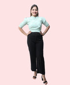 Full length front view women's pista green floral mock neck puff sleeve top black trousers heels Ladymade