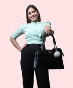 Women's pista green floral print mock neck top styled with black trousers and handbag office look Ladymade