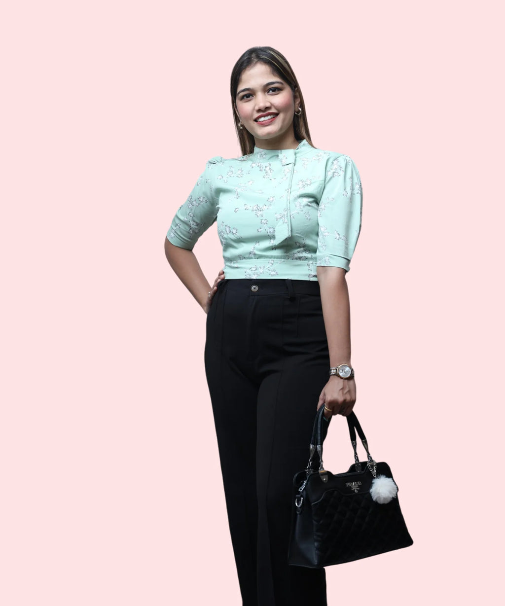 Women's pista green floral mock neck top black trousers handbag complete office workwear look Ladymade