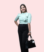 Women's pista green floral mock neck top black trousers handbag complete office workwear look Ladymade