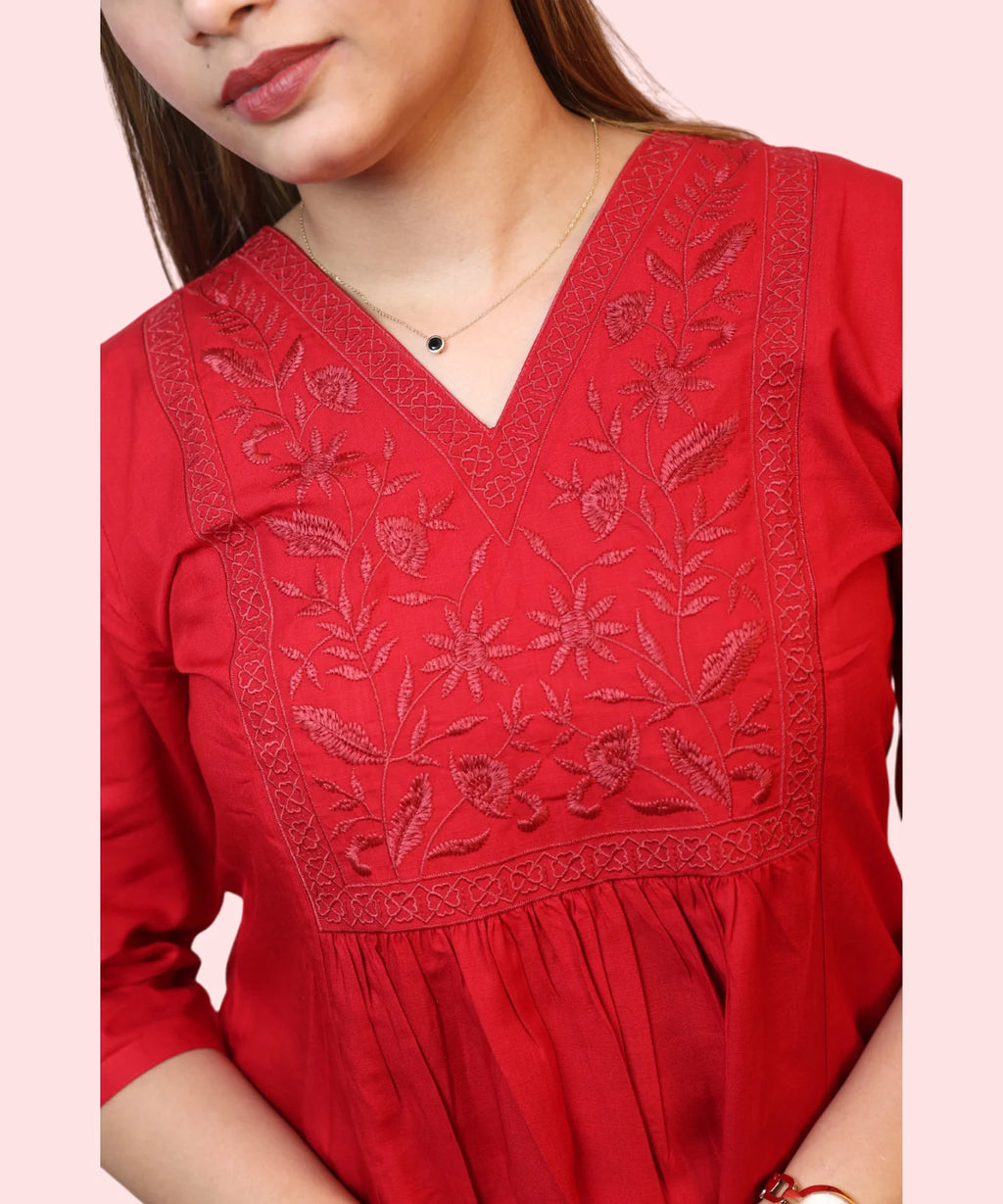 Close-up of floral embroidery on red workwear kurti Ladymade