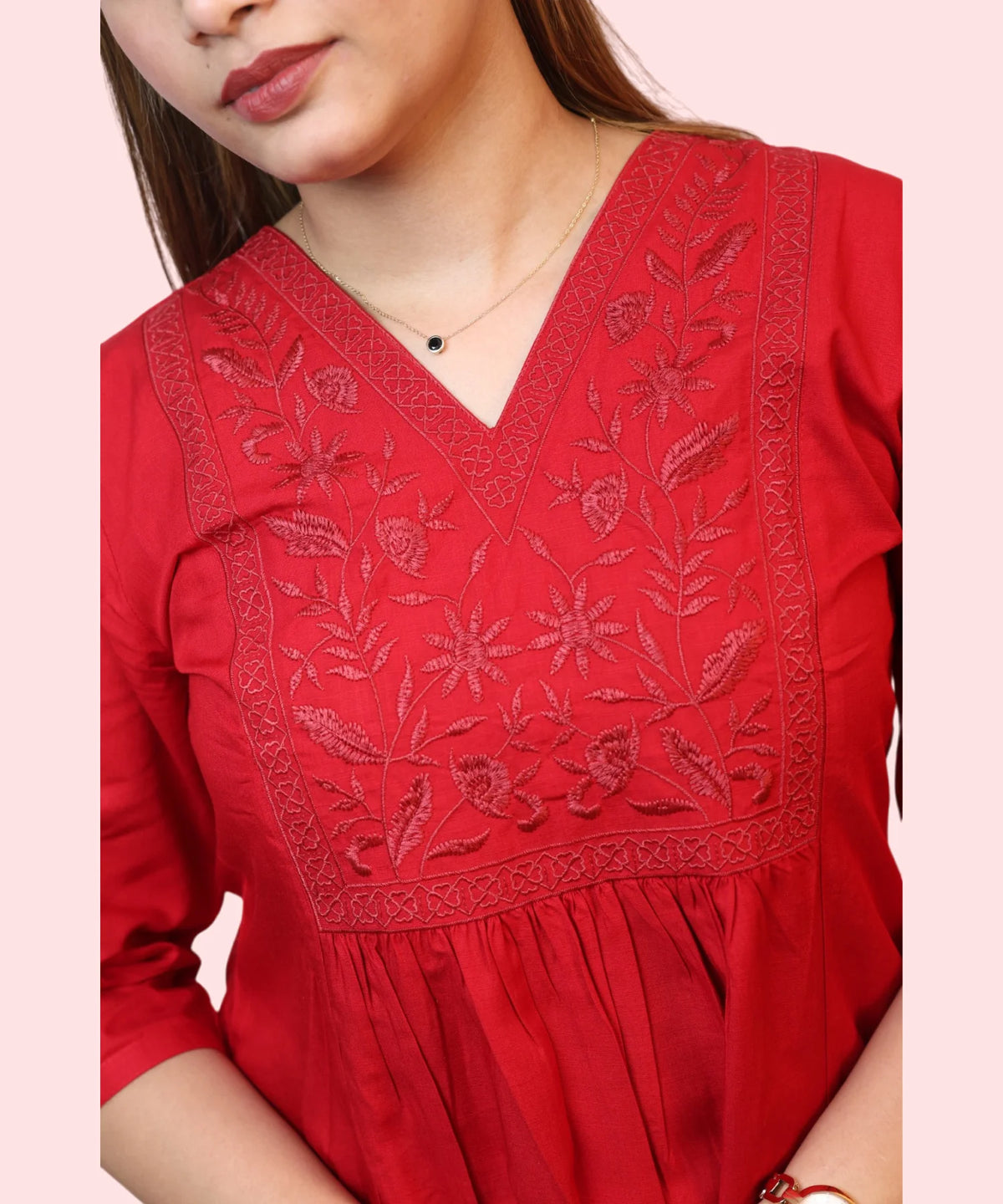 Close-up of floral embroidery on red workwear kurti Ladymade